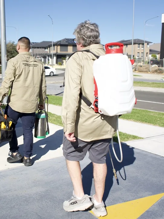 Jimmy and a technician arriving on site with pest control equipment