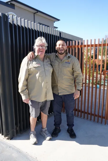 Jimmy with a fellow technician after a pest control visit